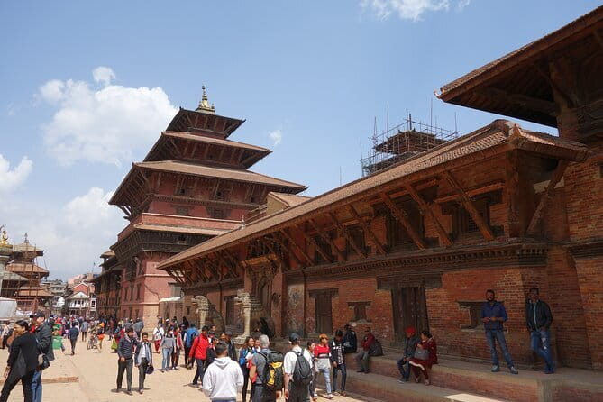 Kathmandu Heritage Day Tour - Boudhanath Stupa beneath prayer flags