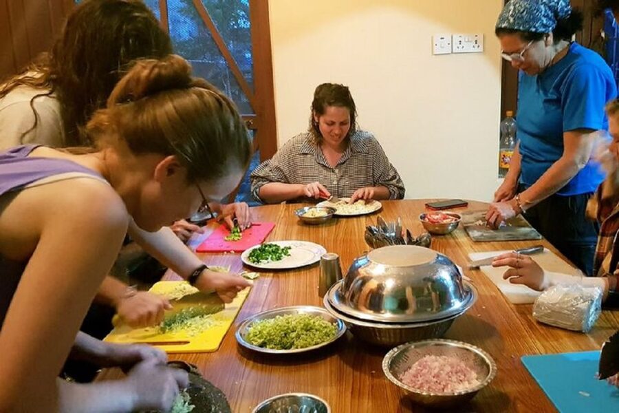 Nepalese Kitchen in Pokhara: Momos or Dal Bhat Cooking Class - What happens during the three-hour visit