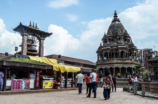 Temples and Stupas Tour in Kathmandu Valley - Boudhanath: the day ends beneath watchful eyes